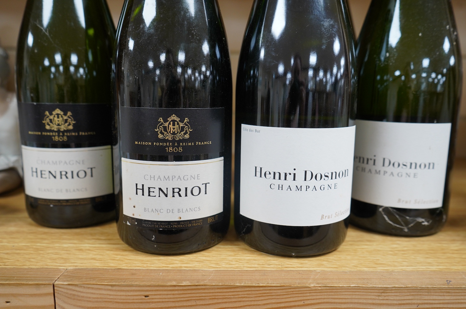 Six bottles of Champagne comprising four bottles of Henri Dosnon and two bottles of Henriot. Condition - good, storage history unknown